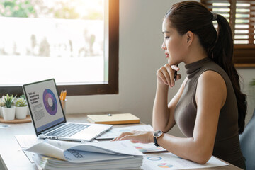 Wall Mural - Accountant Young asian woman working on laptop and do document, tax, exchange, accounting and Financial advisor concept at home