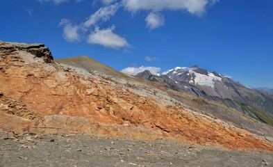 Wall Mural - view on rocky mountain woth glacier of Mont Blanc bckoud under blue sky