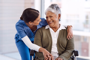 Wall Mural - Healthcare, disability and a nurse hugging an old woman in a wheelchair during a nursing home visit. Medical, hug and funny with a laughing female medicine professional talking to a senior resident