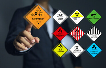 Wall Mural - supervisor or leader pointing to the explosives symbols and all type of the various types of dangero