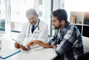 Canvas Print - Healthcare, doctor and patient in consultation with tablet, expert advice, discussion and results. Medicine, health care and Indian man in doctors office, internet and consulting medical professional