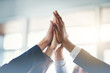 High five, businesspeople and their hands together for cooperation with lens flare. Collaboration or teamwork, group or coworkers support and people with hand in air for unity or achievement