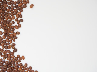 Wall Mural - Roasted coffee beans on white background