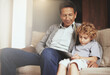 © N Katie/peopleimages.com - Tablet, child or grandfather streaming movie or film on online subscription in retirement at home to relax. Bond, grandparent or kid loves watching fun videos with a senior or mature old man on sofa