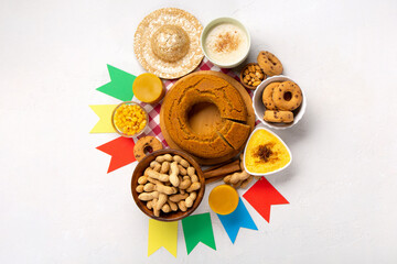 Festa Junina Summer Festival Carnival concept. Brazilian straw hat, popcorn, peanuts and Corn Cake on White Wooden Background