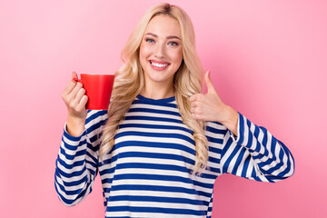 Poster - Photo of young positive business lady wear striped pullover thumb up like recommend espresso macchiato cup isolated on pink color background