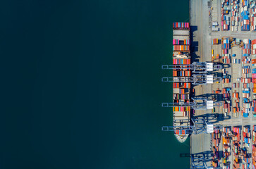 cargo ship and truck at seaport waiting for container dock crane shipment harbor loading container import and export commercial trade business logistic and transportation international.