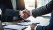 © KikkyCNX - Two businessmen or office workers engage in a handshake in an office, symbolizing teamwork, collaboration, and the shared achievement of success. Generative AI
