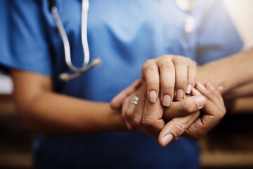 Closeup, doctor holding hands with senior woman and cancer care or support. Healthcare or trust, empathy or compassion and female caregiver or nurse holding elderly person hand for hope and kindness