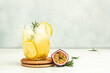 © Надія Коваль - passion fruit drink, Tropical drink for summer party. on a light background, refreshing drink or beverage with ice, place for text