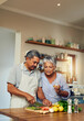© Tamani Chithambo/peopleimages.com - Cooking, old man and woman with wine in kitchen, healthy food and marriage bonding together in home. Drink, glass and vegetables, senior couple with vegetables, meal prep and wellness in retirement.