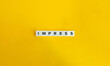© photoopus - Impress Word on Letter Tiles on Yellow Background. Minimal Aesthetics.
