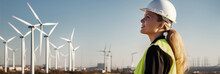Woman Engineer In White Hard Hat At Windmills Power Plant
