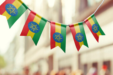 Wall Mural - A garland of Ethiopia national flags on an abstract blurred background