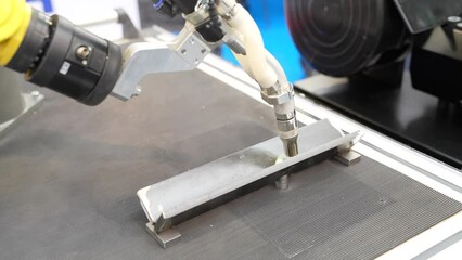 Leinwandbilder - Automatic welding robot in a modern factory in operation.