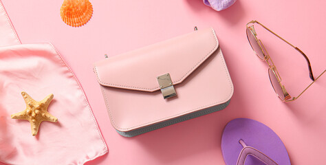 Poster - Stylish bag and accessories on pink background