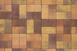 © fotofotofoto - brown and yellow decorative paving slabs close-up