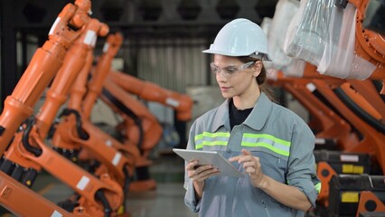 Wall Mural - Maintenance engineer worker working with robotic machine at factory