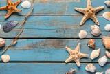 Fototapeta Łazienka - Seashells and starfishes on blue wooden background