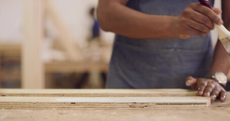 Wall Mural - Wood, carpenter hands and a man with a paintbrush to paint at workshop for manufacturing process. Closeup of male painting for creative furniture project, design and production at carpentry factory