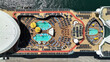 Aerial drone top view of crowded cruise liner ship with pool facilities anchored in Mediterranean port
