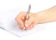 © Tanuha - Woman's hand with a pen writes in a notebook  isolated on a white background.