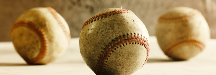 Canvas Print - Baseball banner for team sport with grunge used baseball balls closeup in horizontal view.