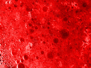 Abstract red texture with spots. Closeup