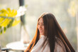 © chokniti - Asian Hairdresser giving treatment and barber occupation service, Professional hairstylist combing and using scissors cut woman's hair to young beautiful customer girl in beauty salon