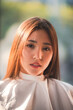 © chokniti - Asian Hairdresser giving treatment and barber occupation service, Professional hairstylist combing and using scissors cut woman's hair to young beautiful customer girl in beauty salon