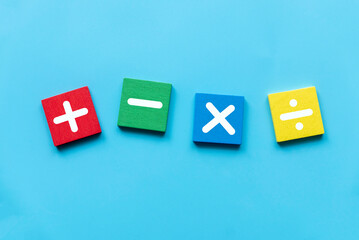 Wall Mural - Concept of education, business, math or calculation. Mathematical operations symbols of plus, minus, multiply, and divide over blue background.