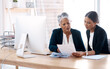 © Tinashe N/peopleimages.com - Mentor, coaching or business women with paperwork talking, speaking or planning project in office. Documents, teamwork collaboration or senior manager reading with intern for administration training