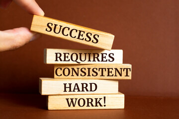 Wall Mural - Wooden blocks with words 'Success requires consistent hard work'. Motivation Quote
