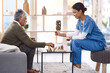 © Tinashe N/peopleimages.com - Caregiver, chess or old woman in nursing home for healthcare, problem solving skills or mental health recovery. Relaxing, nurse or focused mature patient thinking of solution or playing board games
