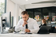 © Nuttapong punna - Asian businessman working in the office with working notepad, tablet and laptop documents at office