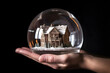House inside crystal ball miniature on hand insurance concept, neural network generated picture. Digitally generated image. Not based on any actual person, scene or pattern. Generative AI