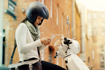 Motorcycle, woman and phone with navigation search in a city with helmet on a street. Motorbike, mobile connectivity and female person with map on urban road with journey and travel on bike