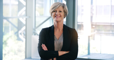 Poster - Business woman, portrait and smile in an office with arms crossed for pride of executive career. Face of a senior female entrepreneur happy about corporate growth, goals and motivation at company