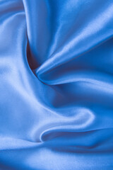 Wall Mural - Abstract blue silk fabric texture background. Creases of satin	
