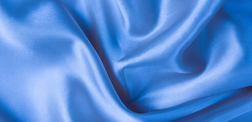 Wall Mural - Abstract blue silk fabric texture background. Creases of satin	
