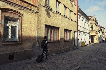 Canvas Print - Walking down the Postavaru Street, medieval pedestrian street in the Old city of Brasov, Transylvania, Romania