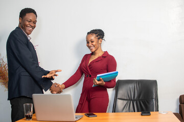 Wall Mural - african business man and woman shake hands