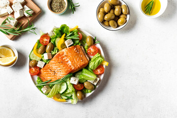 Wall Mural - Grilled salmon fish fillet and greek salad