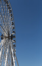 A Ferris Wheel Under The Bright Blue Sky.