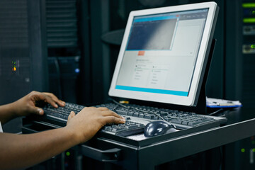 Hands, technician or coding on computer in server room for big data, tech glitch or digital website at night. Support, laptop or person typing testing UX screen, programming or software development