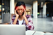 © K Seisa/peopleimages.com - Woman, student and laptop with headache in stress, anxiety or burnout from overworked or studying at campus. Stressed female person or university learner suffering bad head pain, strain or ache