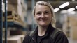 © Summit Art Creations - A smiling Swedish female factory worker standing in warehouse. Generative AI AIG19.