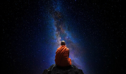 Wall Mural - Buddhist monk looking at the universe. AI generative
