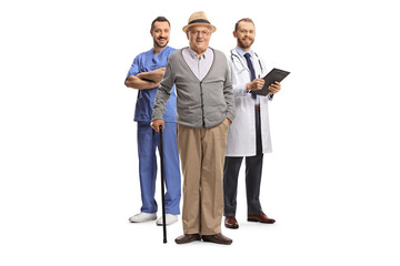 Wall Mural - Elderly male patient with a cane standing in front of doctors