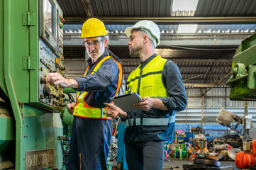 Wall Mural - Two professional engineer worker technician assistant in helmet inspection check old machine construction factory with colleague manager. check old machinery production construction operating